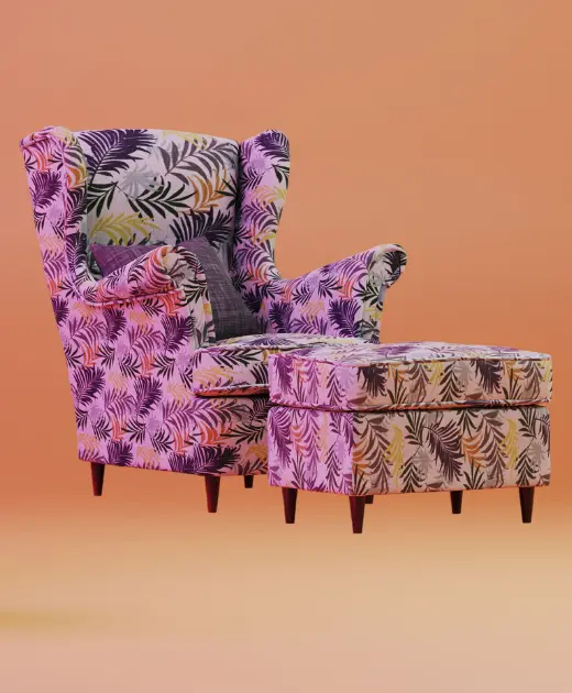 Vibrant floral-patterned armchair with matching ottoman, emphasizing modern sofa designs and custom upholstery services offered by Home Decor across Bahrain.