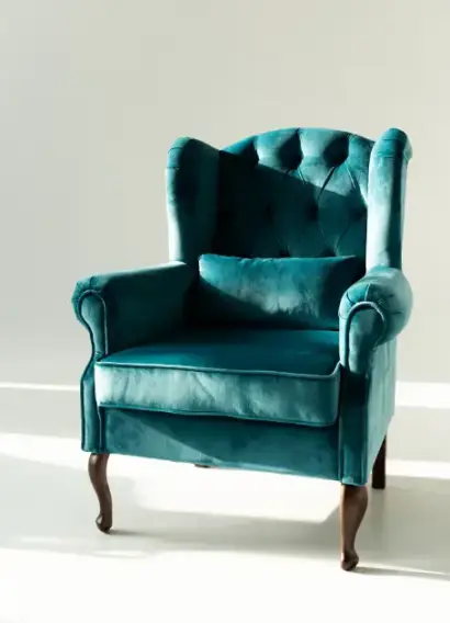 Elegant teal armchair with tufted backrest, showcasing premium sofa upholstery services in Bahrain by Home Decor. Perfect example of luxury fabrics and expert craftsmanship.